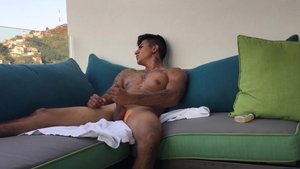 BarebackLatinoz: Erick stroking on sofa